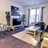 Spacious well lit living room with wood floors 