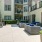 a courtyard with chairs and tables