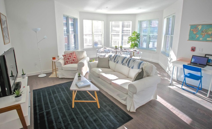 a living room with a couch and a tv