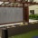a pool deck with showers and seating